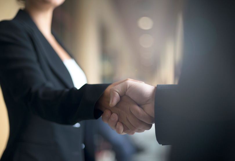 two people shaking hands